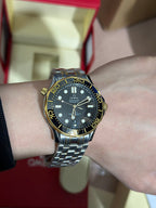 Steel and Yellow Gold Case Bracelet With Black Ceramic Dial Bezel Watch