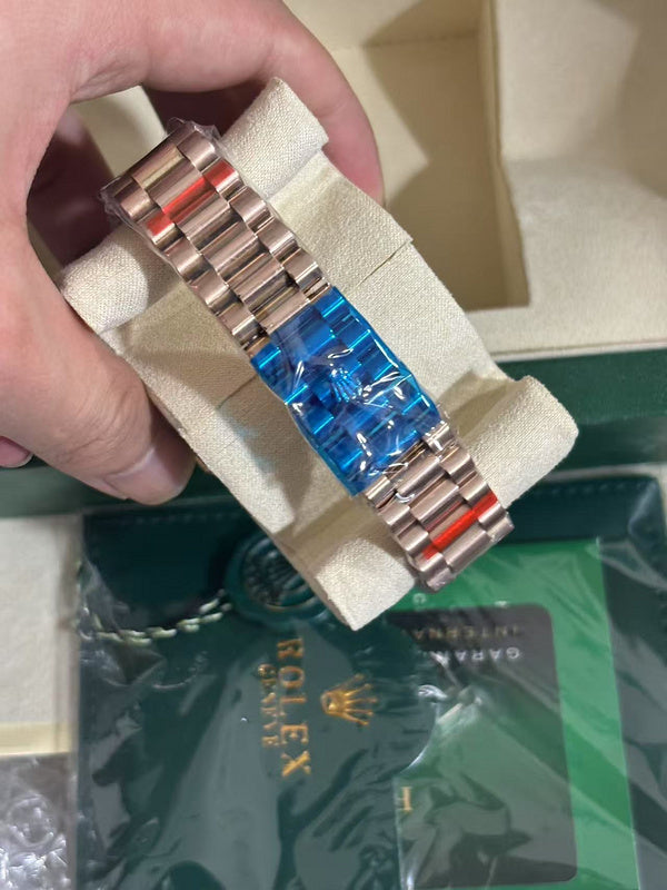 Day-Date 40mm Rose Gold Brown Baguette Dial Diamond Bezel Watch